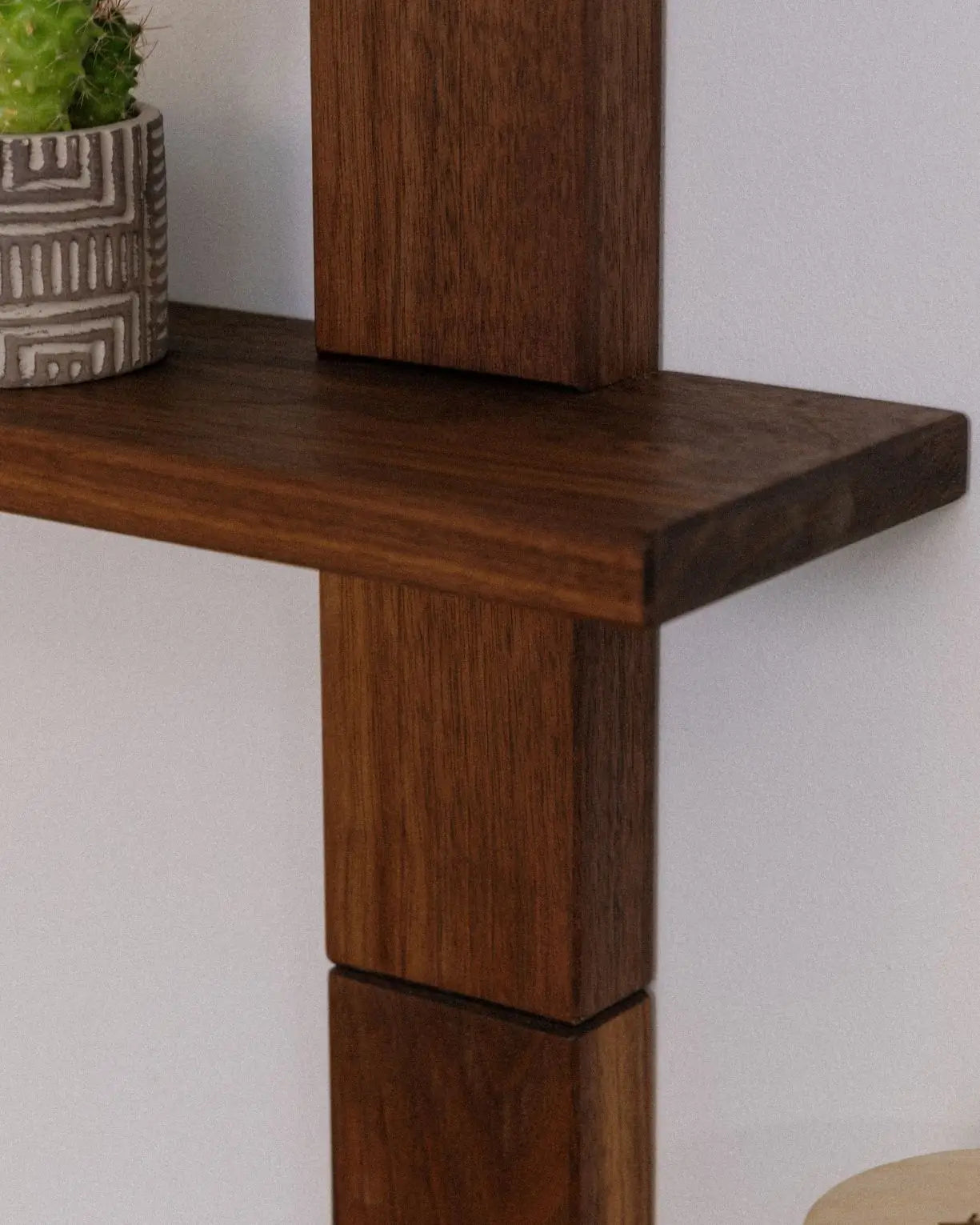 Modern floating wooden shelf with minimalist staggered design – perfect for living room or office organization