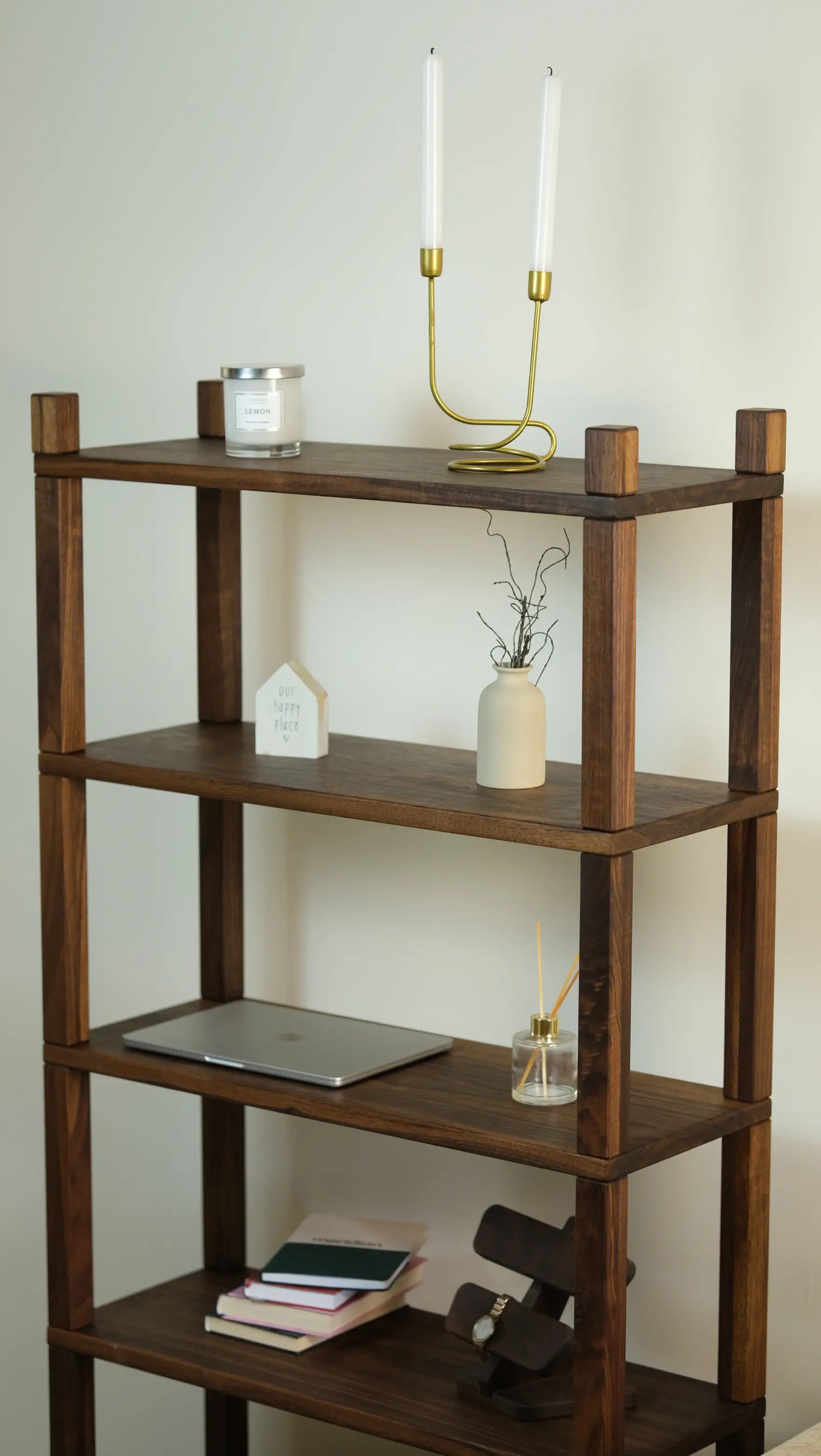 Narrow burnt wood bookshelf – space-saving vertical storage with natural materials