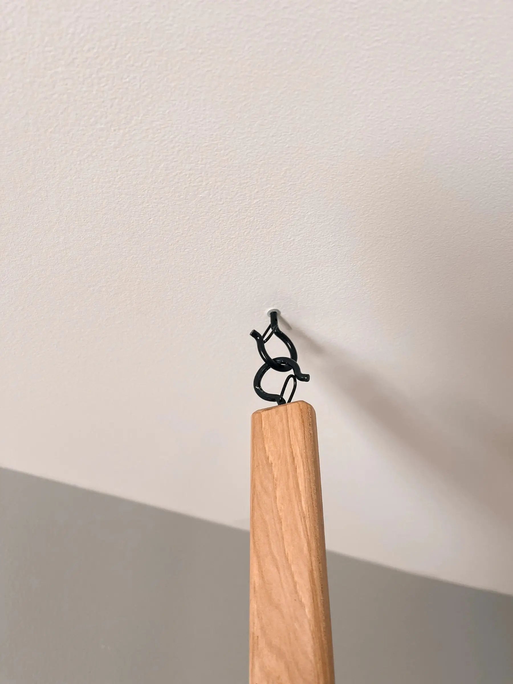 Natural wood hanging rack – ceiling installation for modern and rustic interiors