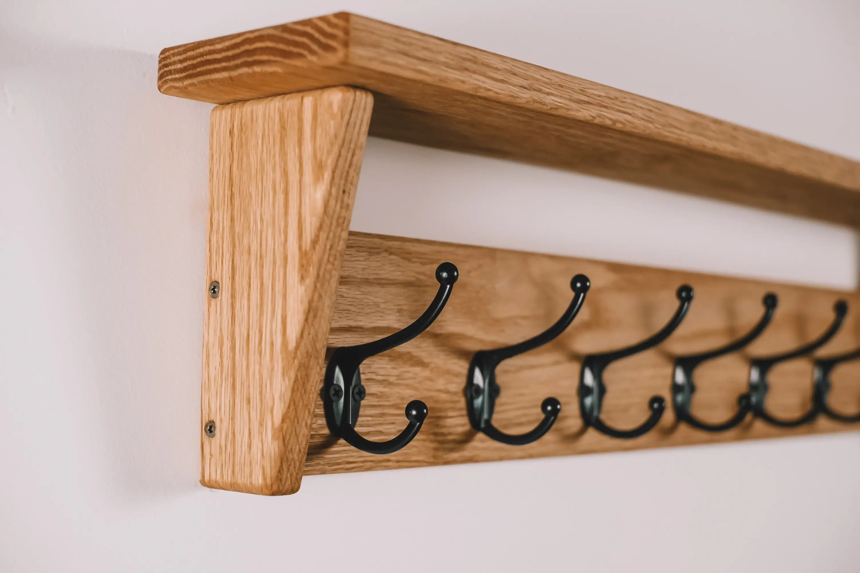 Multi-functional wall coat rack – features wooden hooks and upper storage shelf