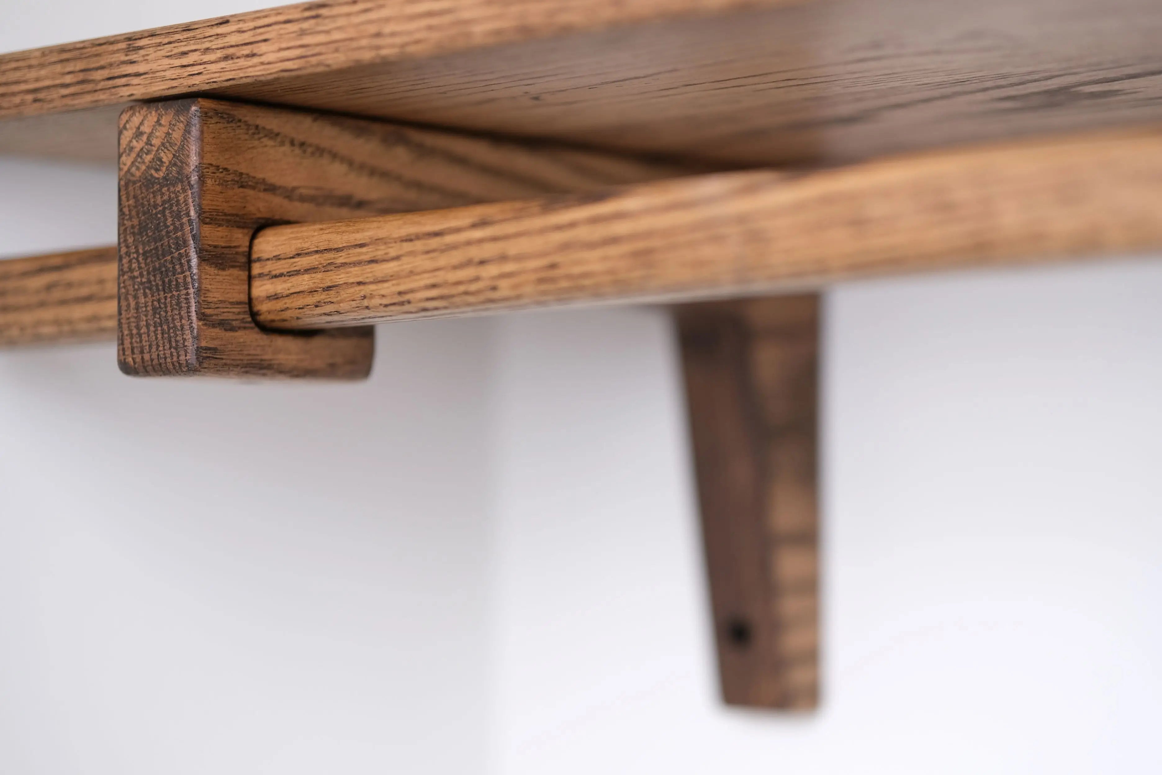Closet shelf made from dark-stained oak – elegant design for folded clothes and accessories