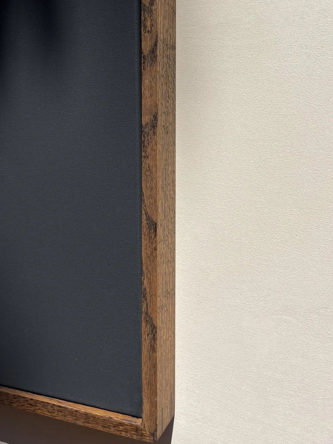 Side view of solid oak canvas frame showing depth and finish

