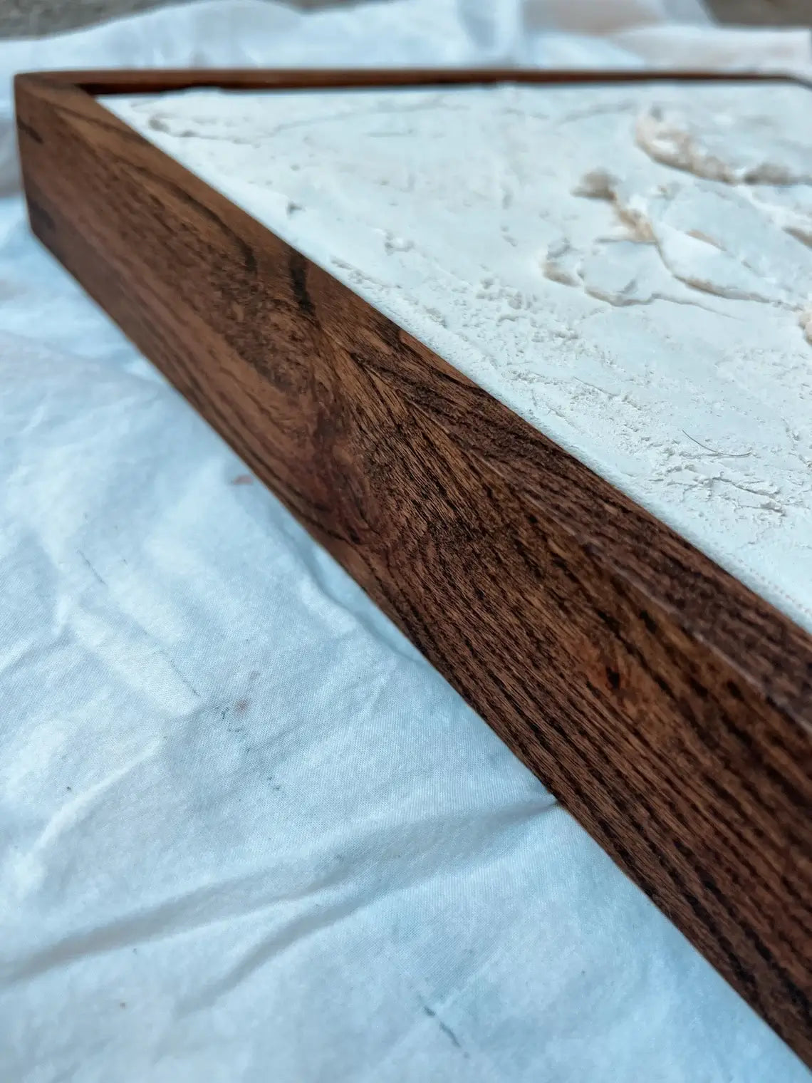 Modern interior with custom oak floating picture frame for canvas

