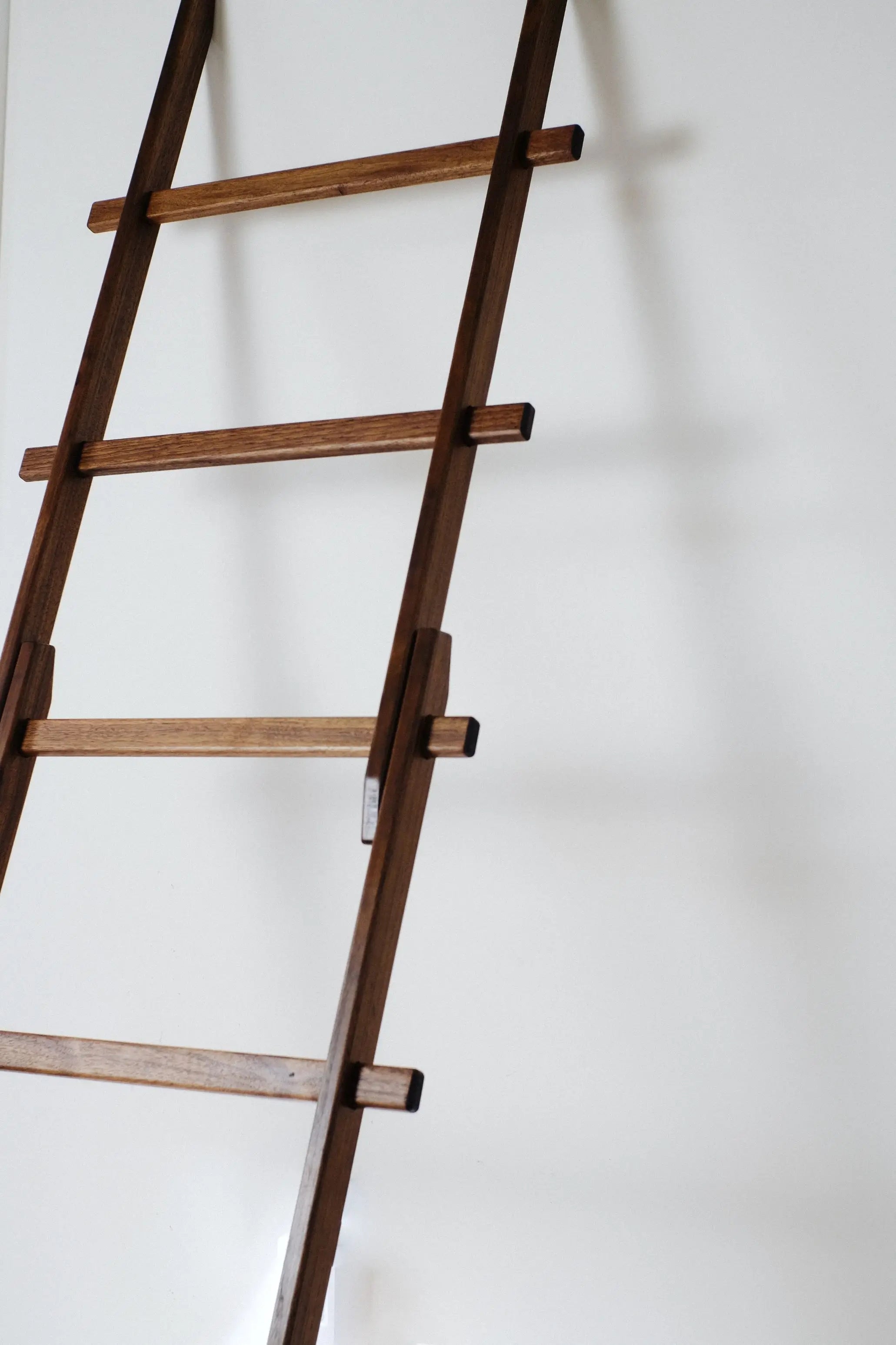 Wall-leaning solid oak ladder rack – eco-friendly display for textiles or accessories