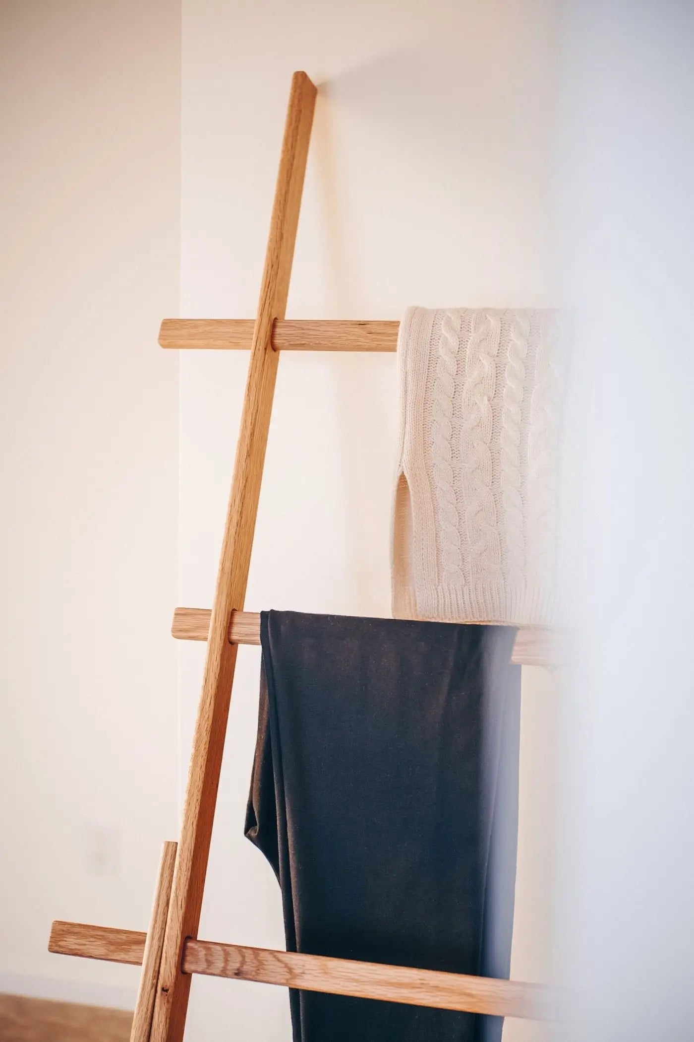 Vertical oak towel and blanket ladder – handcrafted with smooth natural finish