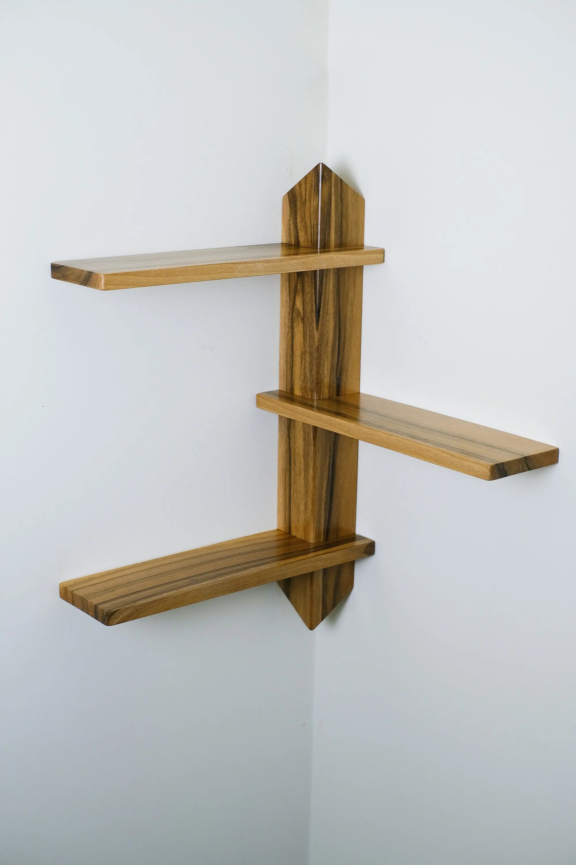 Unique corner wall shelf made of real wood – space-saving and decorative solution