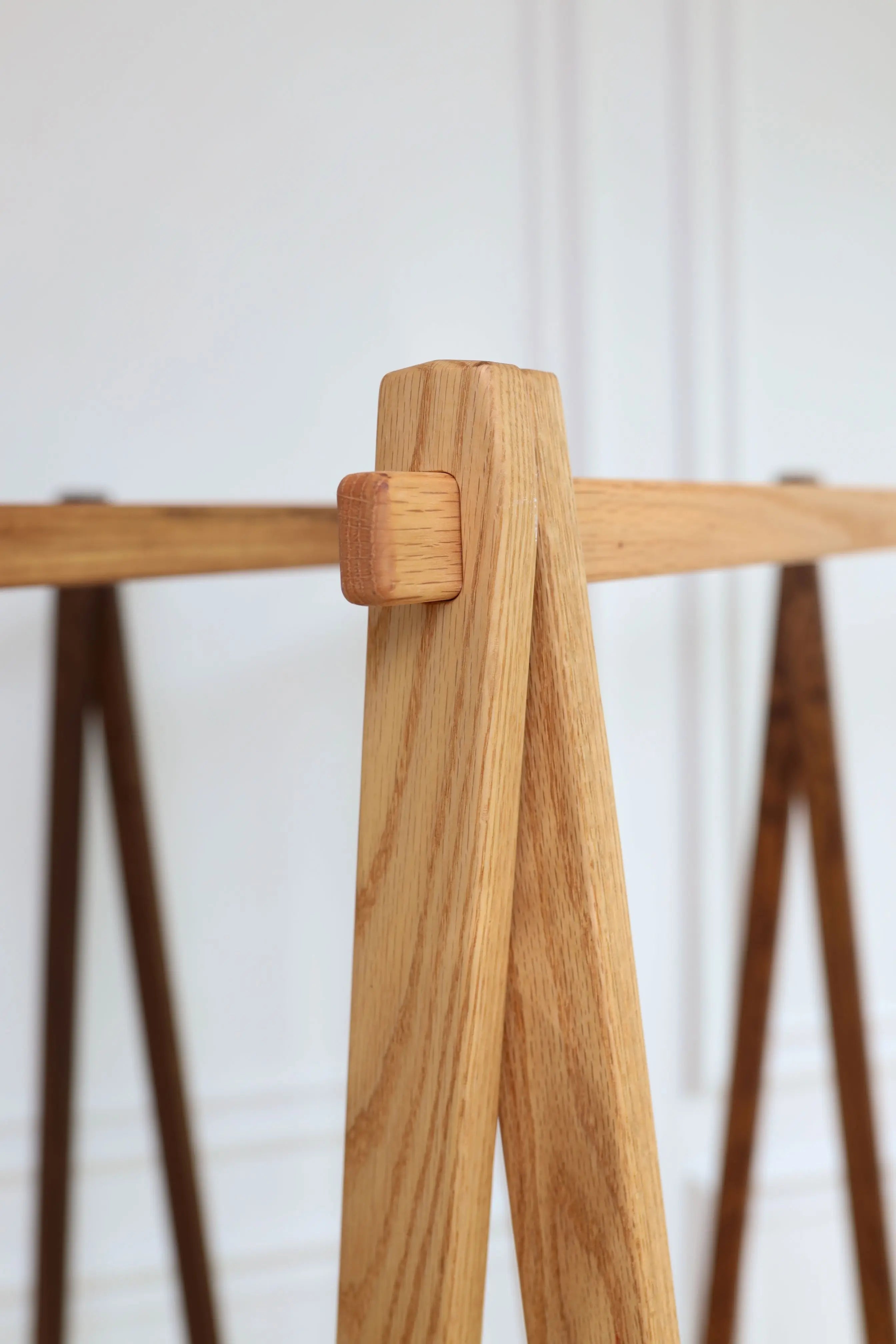 Wooden coat rack with a white background