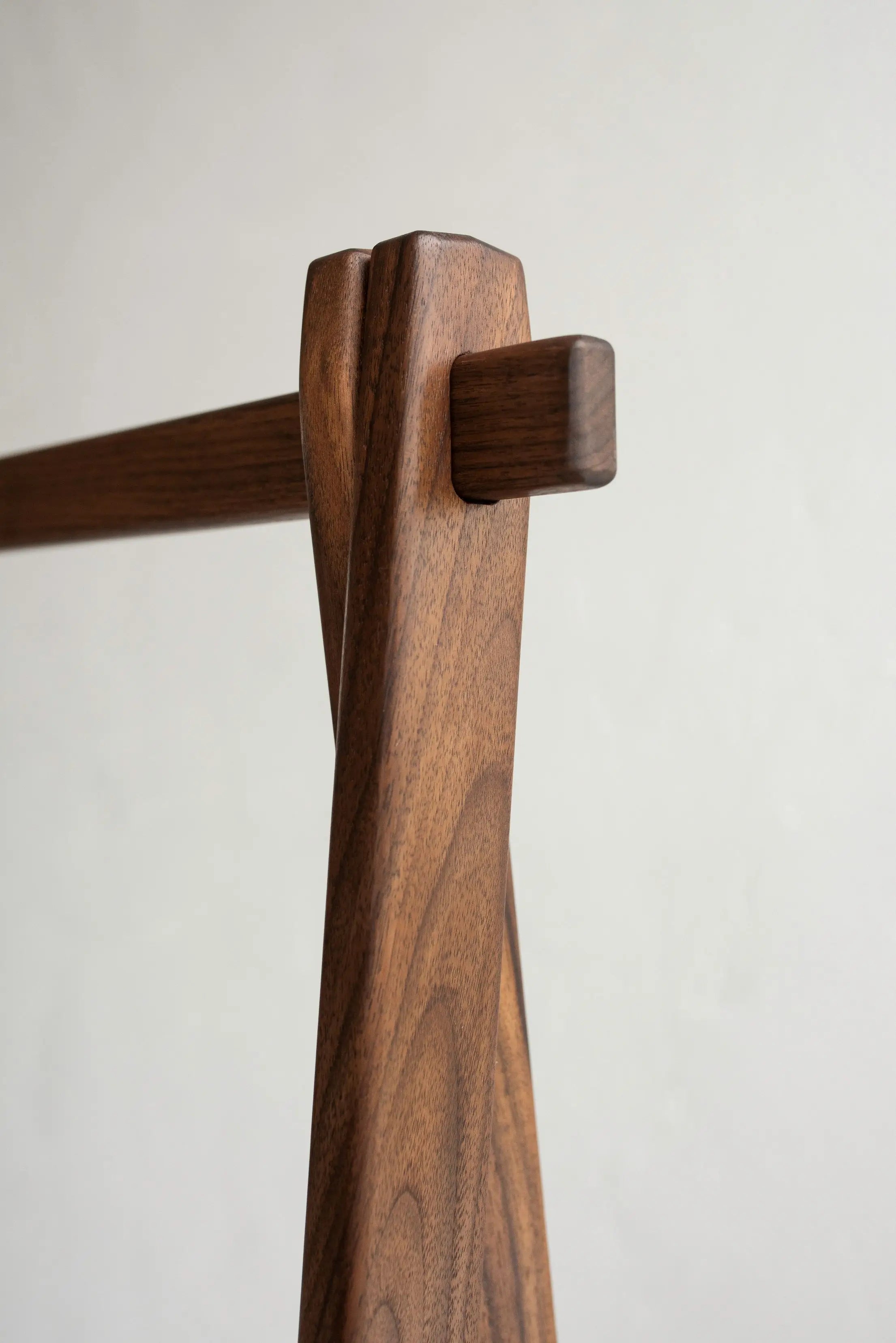 Wooden hanger with a plain background