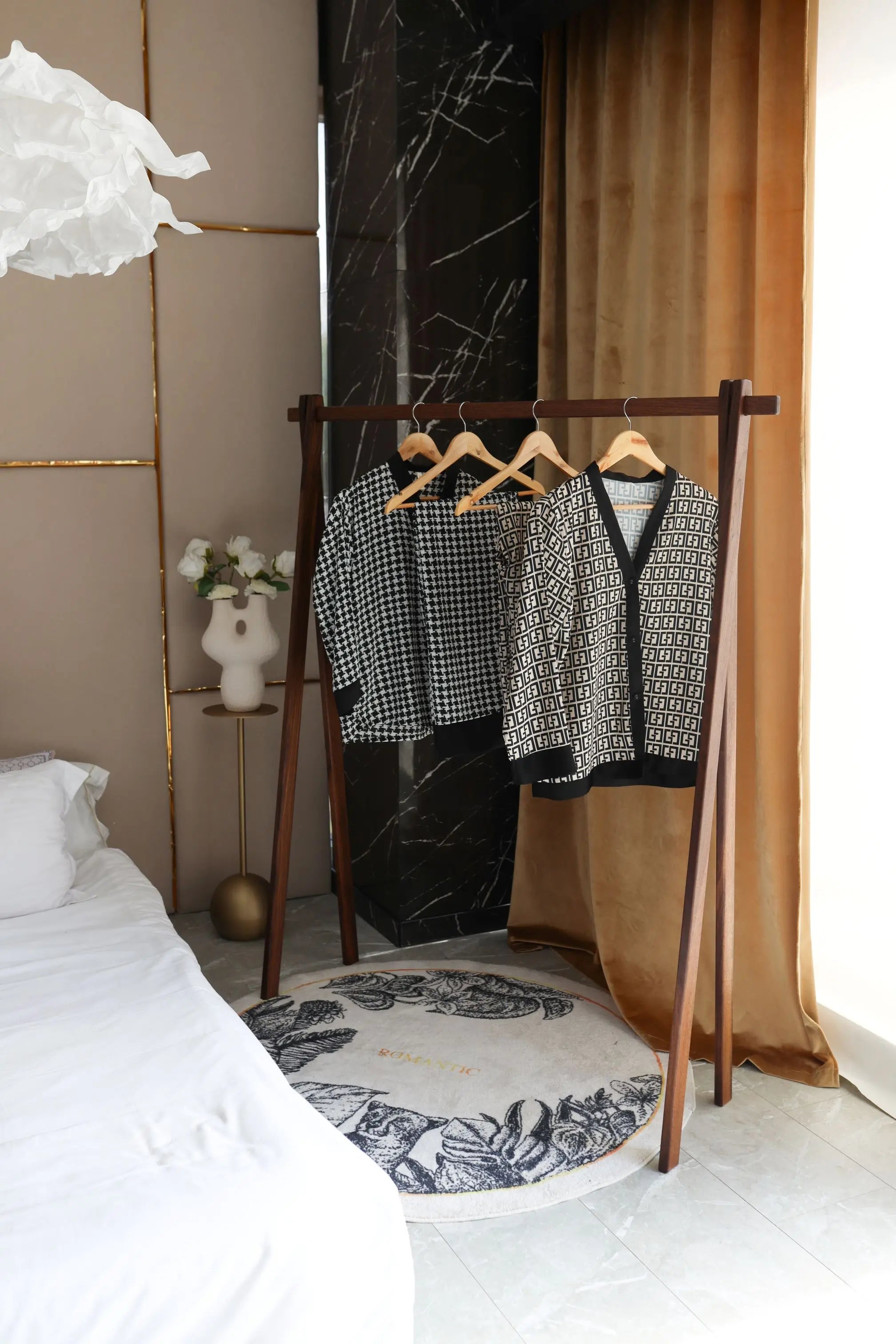 Clothing rack with shirts in a bedroom setting